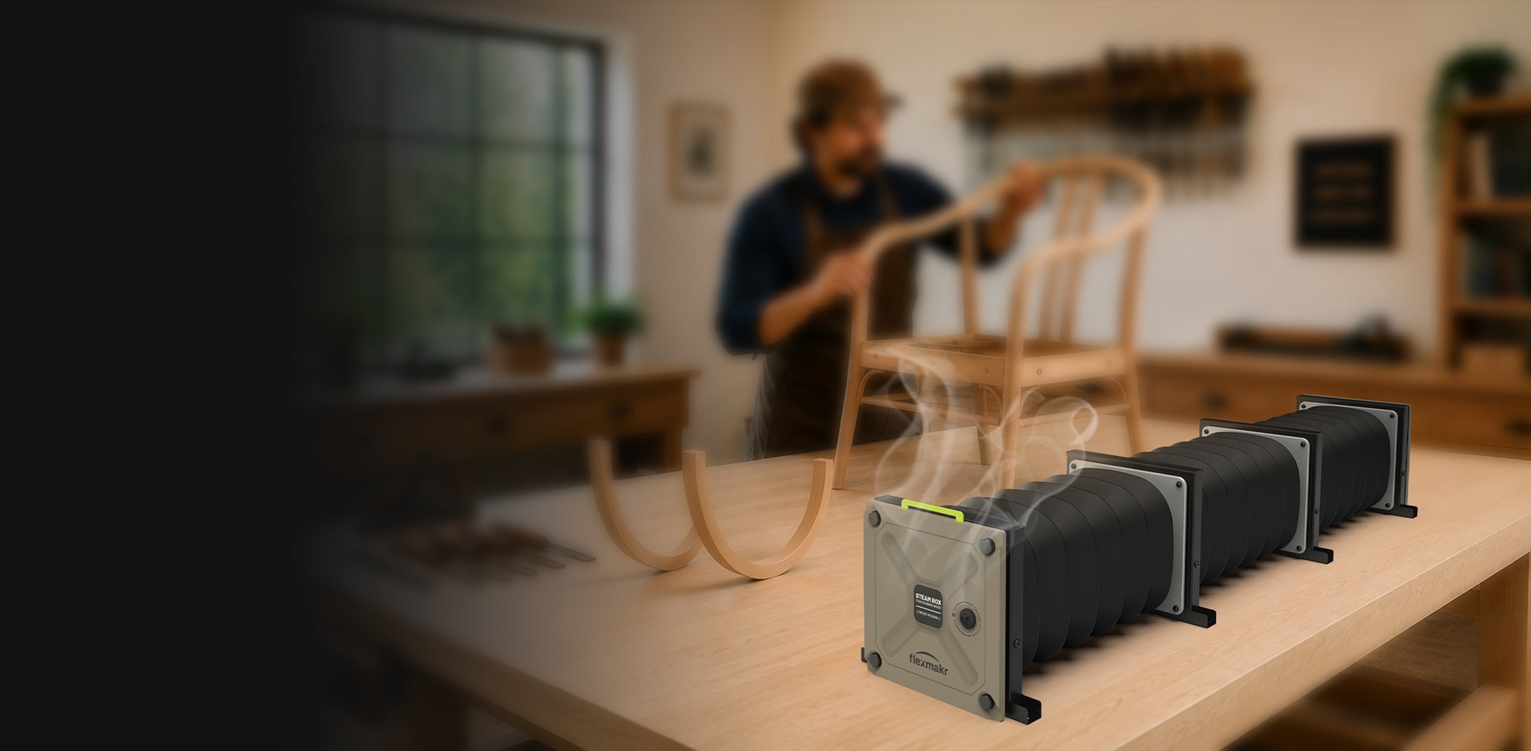 Woodworker working on a steam bent chair made using the Flexmakr modular steam box shown in foreground. 